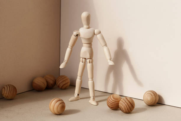 istock Wooden puppet  and balls 995603536