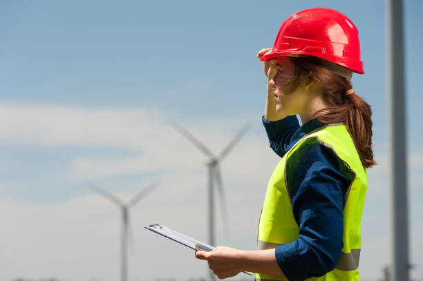 istock Concept of engineers and windmills 995603926