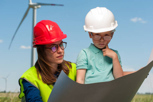 istock Concept of engineers and windmills 995604144