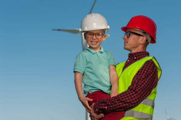 istock Concept of engineers and windmills 995608964