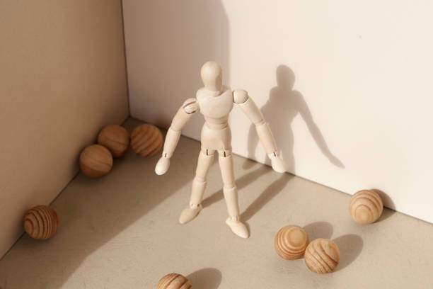 istock Wooden puppet  and balls 995613438