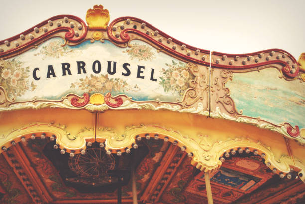 Photography of a horse carrousel attraction in an amusement park.
