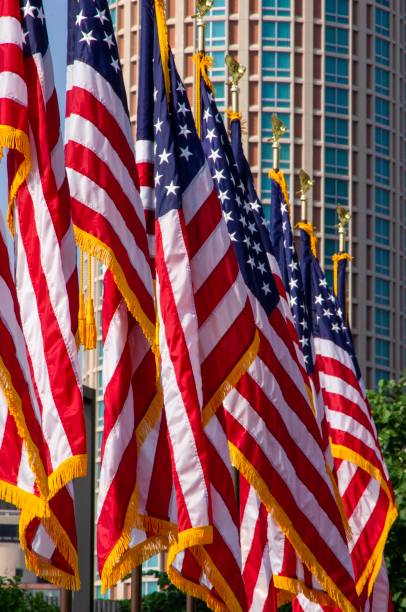 istock Row of American flags in urban setting 995618174
