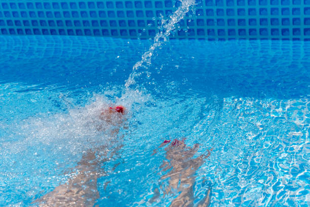 istock girl in swimming pool 995625424
