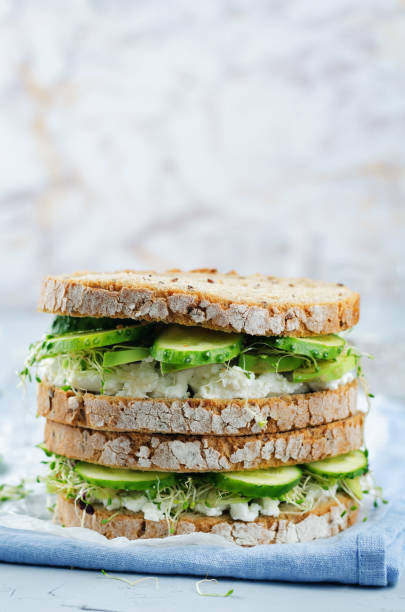istock Ricotta sprouts avocado cucumber rye sandwich 995627500