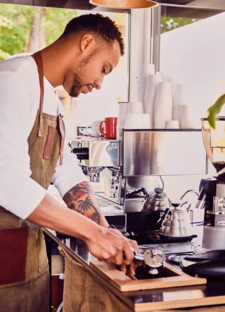 istock Man pouring coffee in a restaurant. 995641424