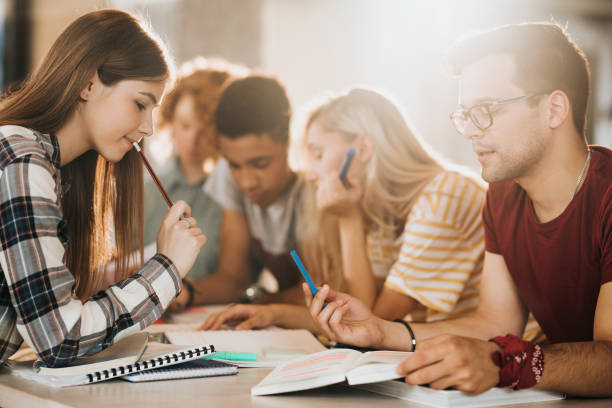 istock University students studying in team for the upcoming exams. 995642738