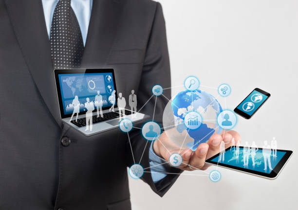istock Man with technology icons floating above his hand 995642772