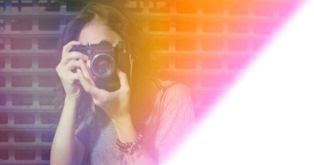istock Bluury image of girl taking photo with light leak 995651246