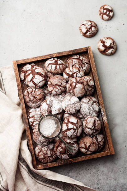 istock Chocolate brownie cookies in powdered sugar. Chocolate Crinkles. 995651604