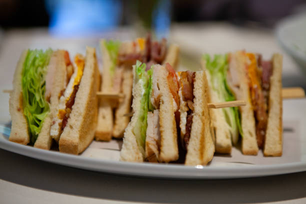 Close up of Club sandwiches. Close up of Club sandwiches by its side. Can see all delicious filling. sandwich club sandwich lunch restaurant stock pictures, royalty-free photos & images