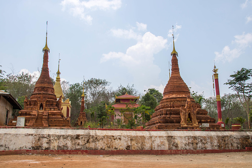 A group of pagodas by the entrance to the Shwe Inn Tain Pagodas, a religious site with hundreds of pagodas, some dating back to the 12th Century.