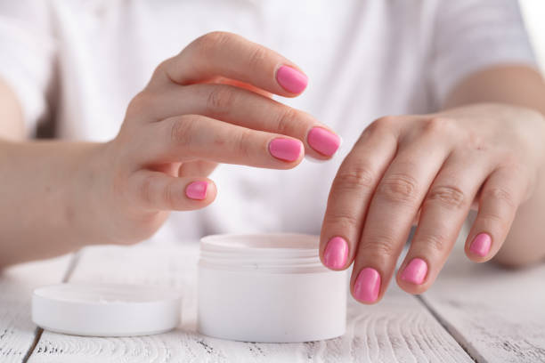 istock Woman applying hand cream 995677304