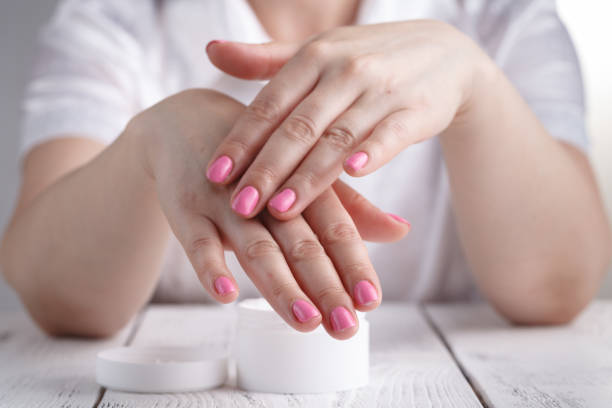 istock Woman applying hand cream 995687160