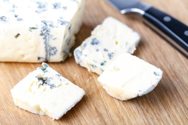 istock blue cheese on a wooden background 995692778