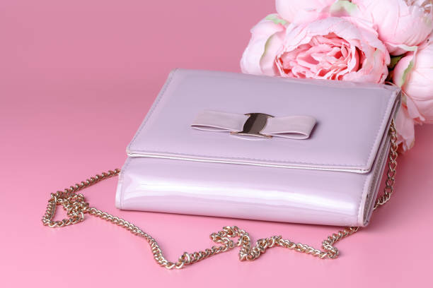 istock Female lady clatch bag on pink background 995696046