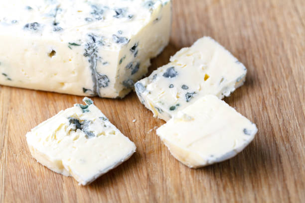 istock blue cheese on a wooden background 995696458