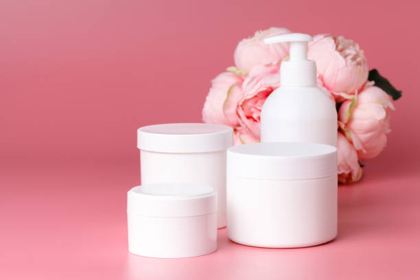 istock Few cosmetic bottle on pink background, mockup 995696520