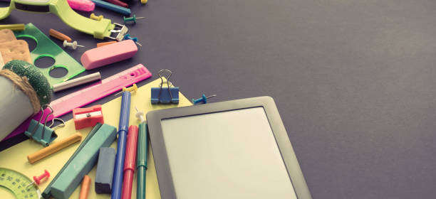 istock Banner Concept back to school apple backpack stationery on black background. 995722488