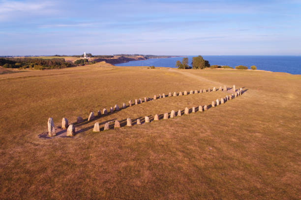 But stones Aerial view of the prehistoric stone ship Ale stone in southern Sweden at Kaseberga in province of Scania ales stenar stock pictures, royalty-free photos & images
