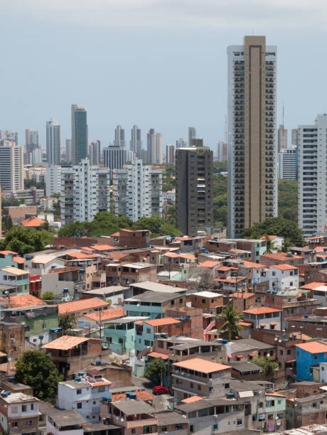 istock Favela and buildings - Urban social contrast 995728310
