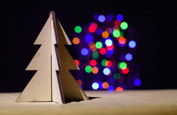 istock Christmas toy tree on bokeh blur light background 995733328