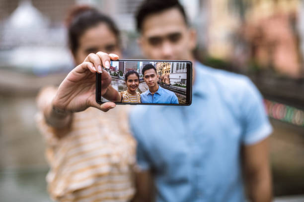 istock Couple Taking a selfie in Kuala Lumpur 995739524