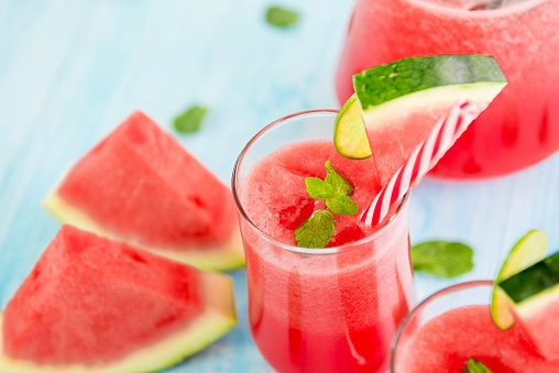 Colorful refreshing drinks for summer, cold watermelon lemonade juice smoothies in the glasses