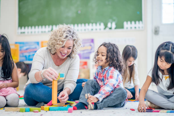 istock Preschool kids and teacher 995753624