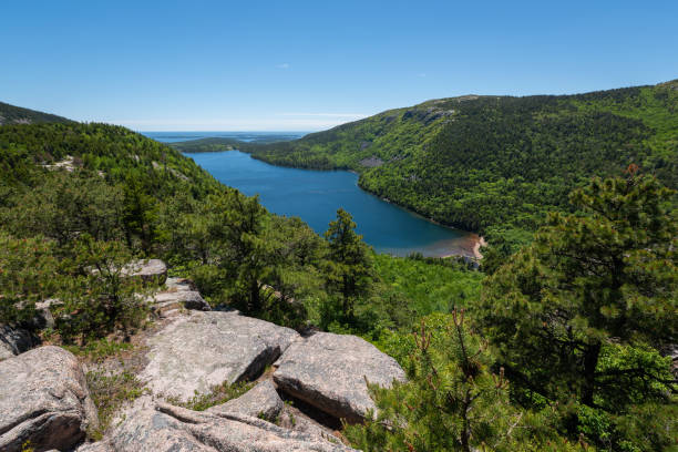 istock Edge of a cliff overlooking Jordan Pond 995754372