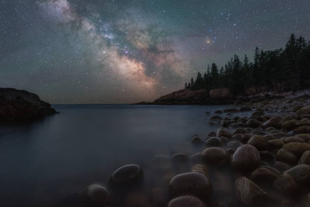 Milky Way Galaxy rising over Boulder Beach Gorgeous night sky along the Acadia National Park coastline. acadia national park maine stock pictures, royalty-free photos & images