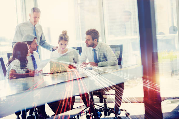 istock Five businesspeople working at the boardroom table. 995757234
