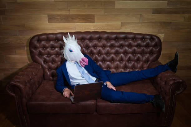 istock Strange man in suit working at home office 995771298