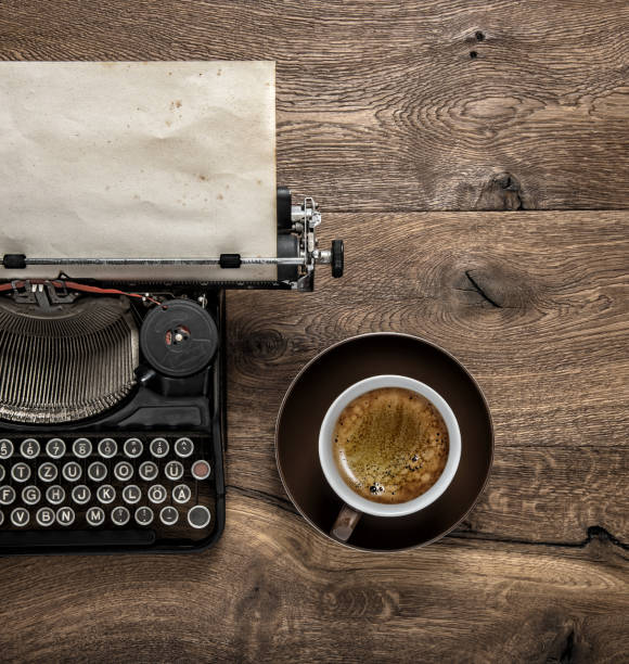 istock Antique typewriter grungy textured paper coffee 995786970