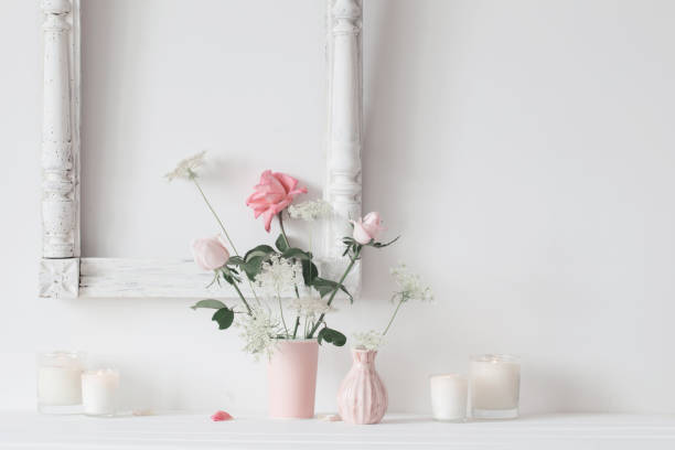 istock still life with pink roses and candles on white background 995787700