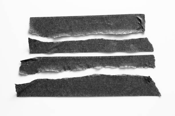 istock Set of black tapes on white background. Torn horizontal and different size black sticky tape, adhesive pieces. 995790528
