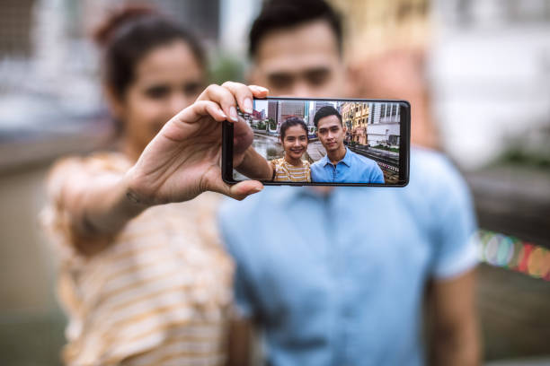 istock Couple Taking a selfie in Kuala Lumpur 995800064