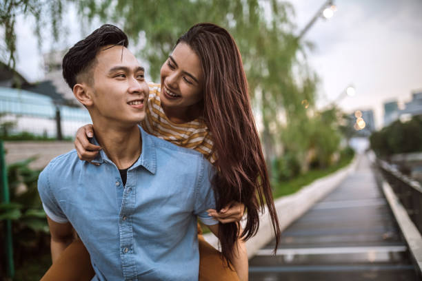 istock Boyfriend Carrying His Girlfriend On Piggyback 995804260