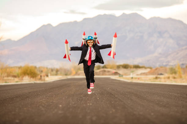 Young Business Boy with Rockets