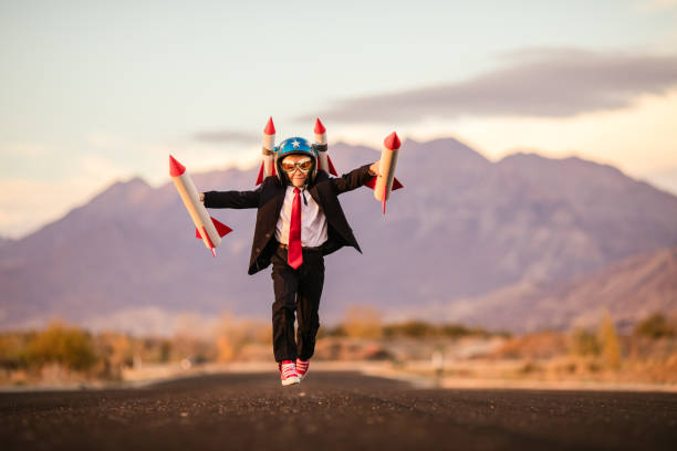 istock Young Business Boy with Rocket Helmet 995808282