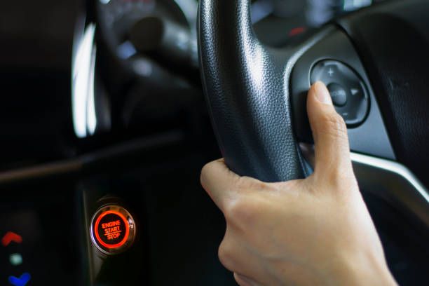 istock Woman pressing control button on the car steering wheel 995861286