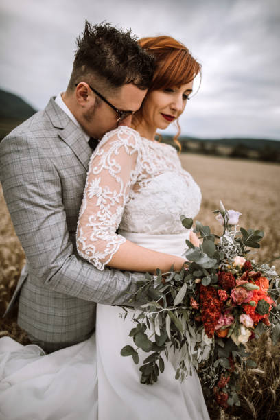 istock Newlyweds Celebrating Their Wedding Day In Rural Scenery 995869120