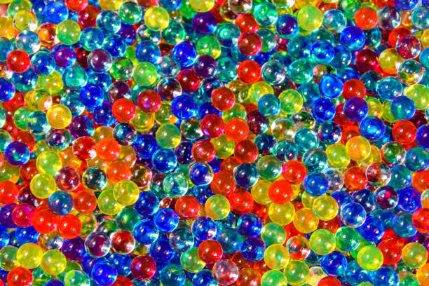 istock Texture of multicolored hydrogel balls for the background 995873680