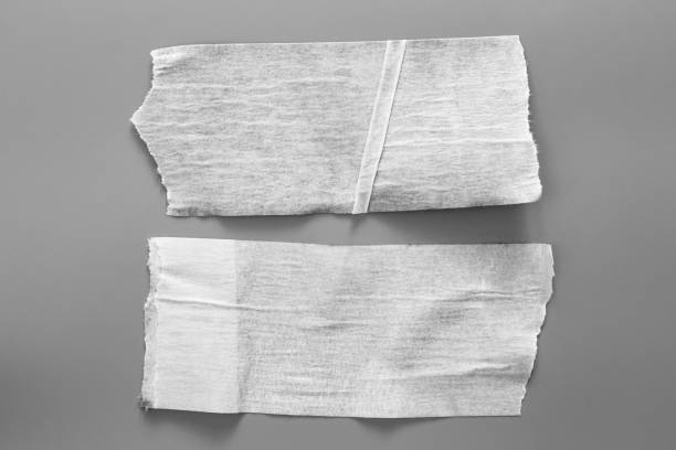 istock Set of white tapes on gray background. Torn horizontal and different size white sticky tape, adhesive pieces. 995873806