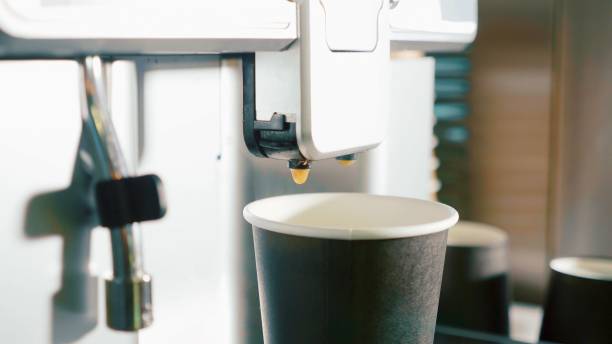 istock Process of making coffee by coffee machine pour coffee into the cup 995880476