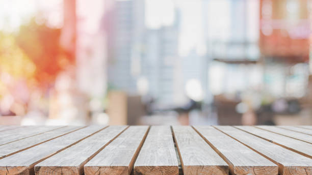 istock Empty wood table top and blurred restaurant interior background - can used for display or montage your products. 995887316