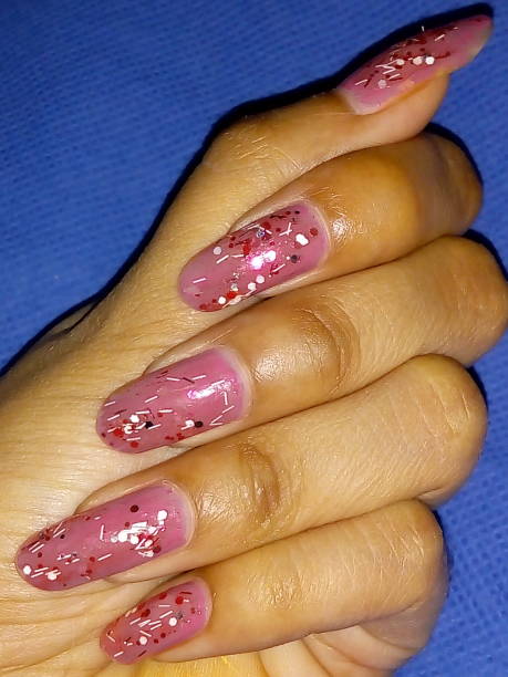 istock Adorn hand nails pink polish 995898510