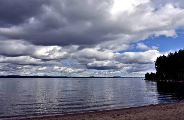 istock dark grey sky over the calm lake 995903222
