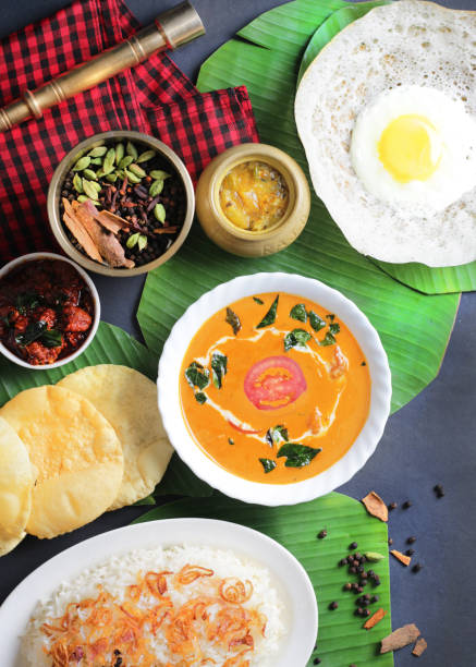 Top Shot of South Indian Thali Meal with Rice, Curry, Puri, Chapati and Half Fried Eggs