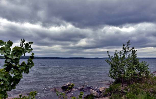 istock dark gray sky over the restless lake 995909874